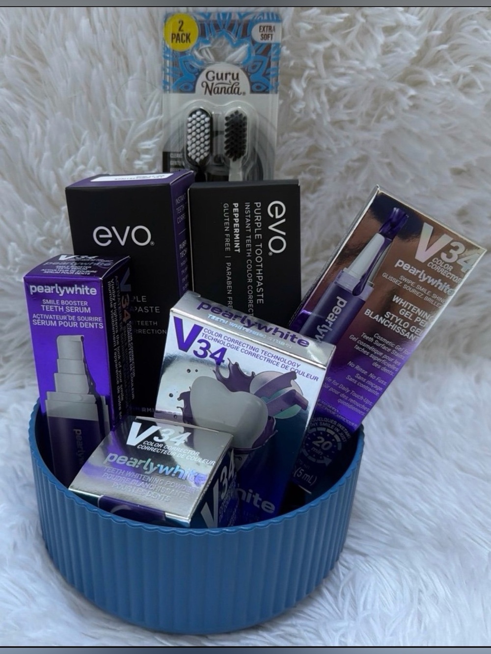 Evo purple toothpaste. The total seven items plus the vase.